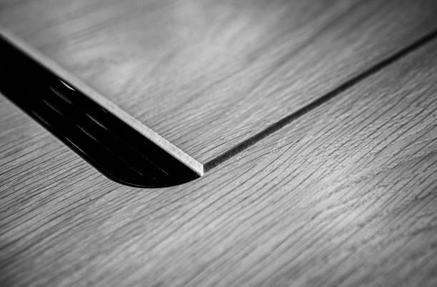 istock Empty rough wooden table top in the dark room 1545506786