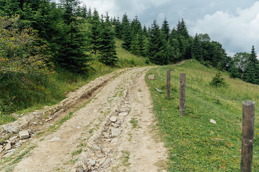 The old rocky soil road in the mountains for walking people and for driving on off -road cars.