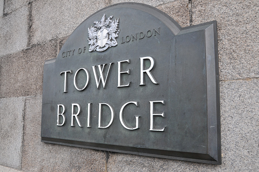 An eye-catching sign of Tower Bridge mounted on a wall, capturing the essence of London, England, UK.