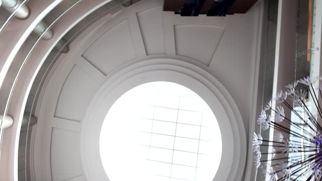 Ceiling with round glass skylight in lobby 4k movie