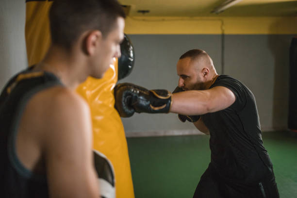 istock Two focused boxers train in the gym 1545545579