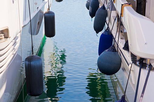 Newport, Rhode Island, USA - 2 July 2021: A bunch of boats that are docked in the water.