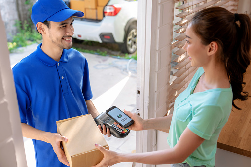 Delivery staff deliver products to customers at home.