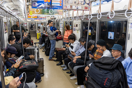 Tokyo, Japan - October 24, 2019: Full People of Tokyo Train Car. People are traveling from airport to Tokyo City. Keisei Main Line Rapid Limited Express