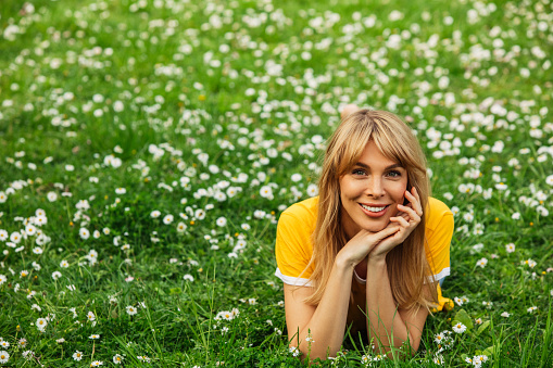 Smiling young woman enjoying summer