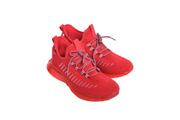 Red running shoes isolated on white background.