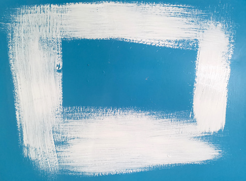 White paint frame on blue wall