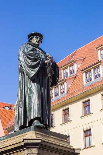 Statue of Martin Luther on the historic market square of Eisleben, Germany