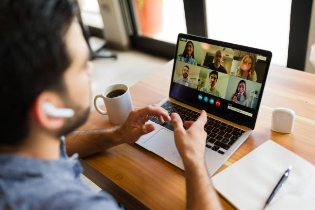 istock Rear view of a freelancer worker on a video call working remotely 1545694481