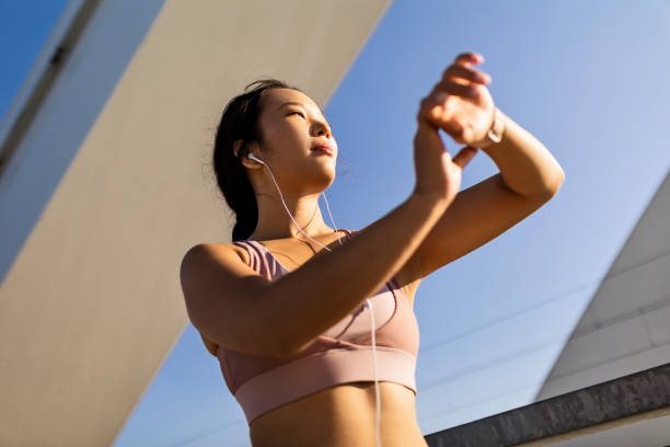 istock Joyful Asian Woman's Fitness Pause 1545737785