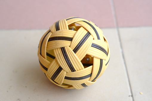 a close up of a ball on a tile floor