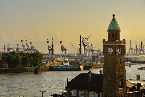 Silhouettes of Hamburg buildings at sunset. Golden sunset in the port of Hamburg.