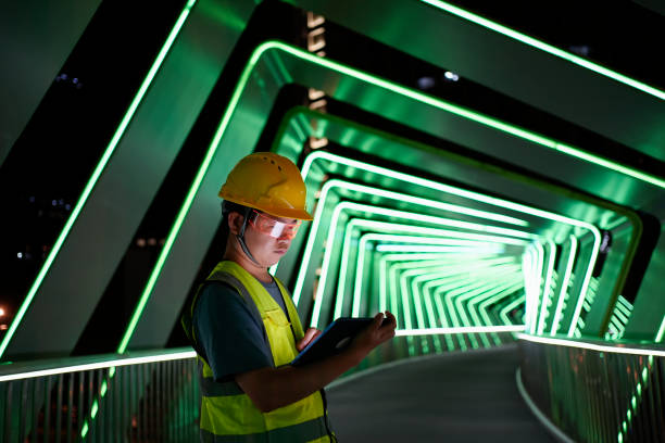 istock Engineers wear smart glasses and use tablets to adjust the lights 1545788327