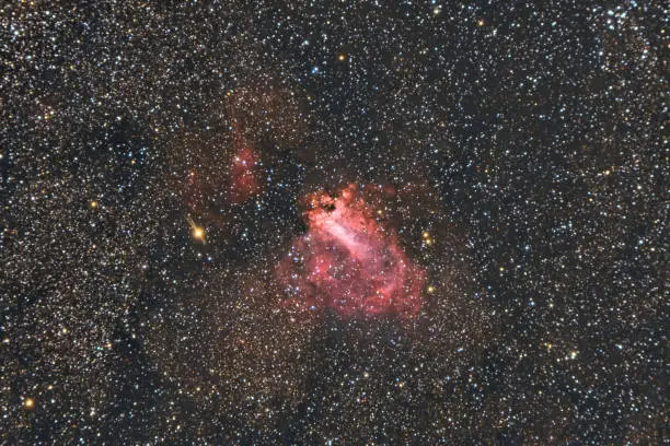 The Omega Nebula, also known as the Swan Nebula, Checkmark Nebula, and Horseshoe Nebula Messier 17, M17, captured with a refracting telescope