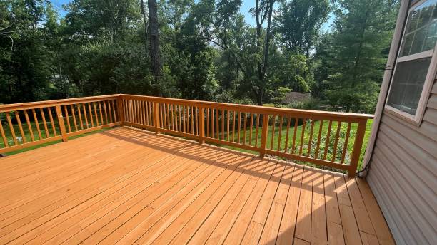 istock a wooden deck with sliding doors next to a green tree 1545790641