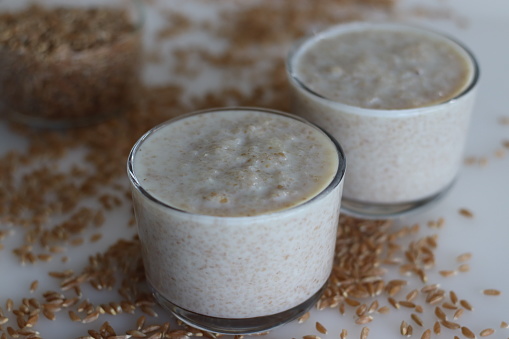 Khapli wheat porridge. Healthy porridge made of broken emmer wheat, simmered in milk. A version of porridge with oldest wheat varieties of India. Shot on white background