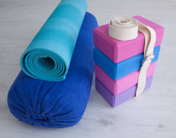 istock yoga props blocks, strap, roller and carpet 1545801188
