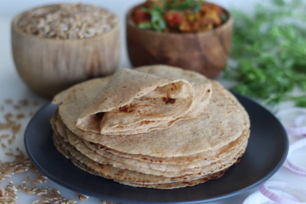 istock Khapli wheat roti served with baingan bharta. 1545801470