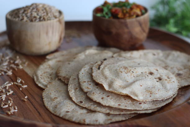 istock Khapli wheat roti served with baingan bharta. 1545801472