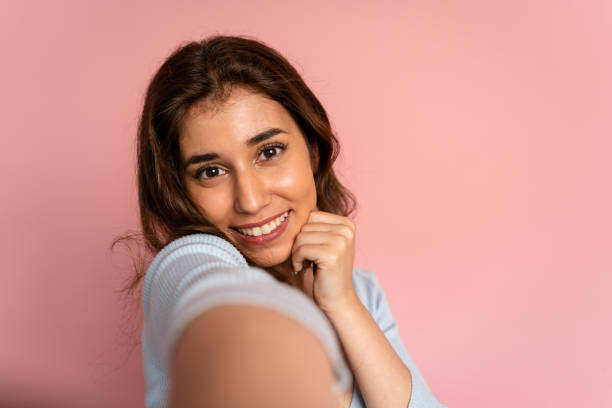 istock Smiling brunette woman in studio shot. 1545807475