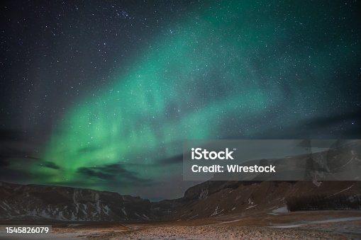 istock aurora borealis in the night sky above Reykjavik, Iceland, with stars twinkling in the background 1545826079