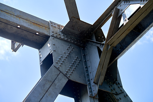 a fragment of an iron structure against a blue sky