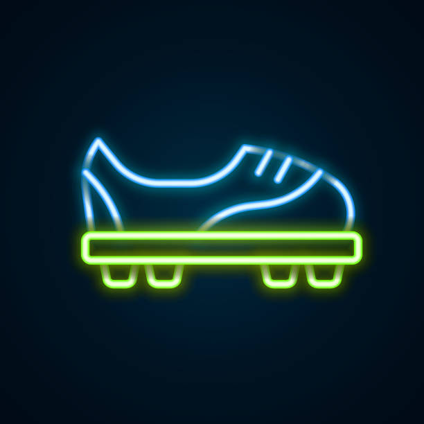 ilustraciones, imágenes clip art, dibujos animados e iconos de stock de línea de neón brillante icono de zapatillas de fútbol aislado sobre fondo negro. botas de fútbol. protección deportiva de los pies de fútbol. concepto de esquema colorido. vector - football outline lace vector