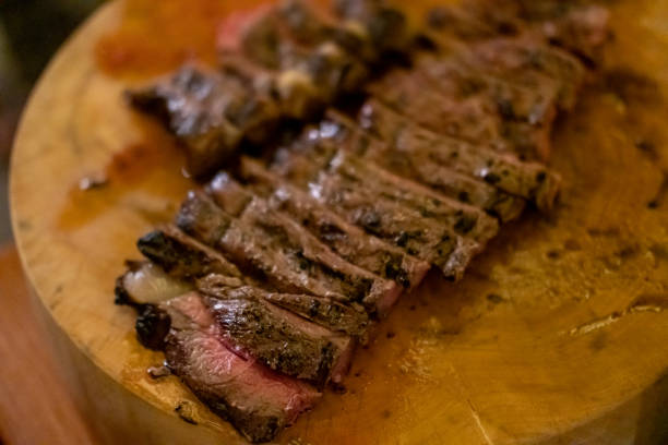 istock Medium rare meat on wooden plate 1545853964