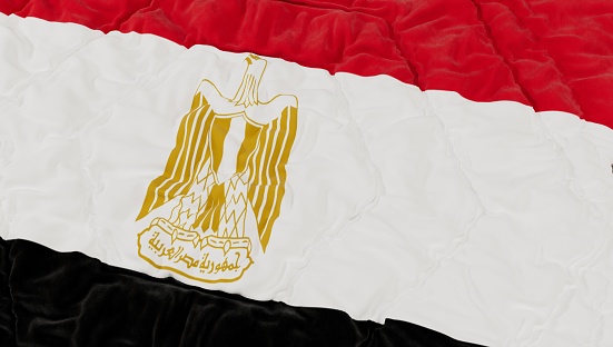 Egypt flag waving on the flagpole on a sky background