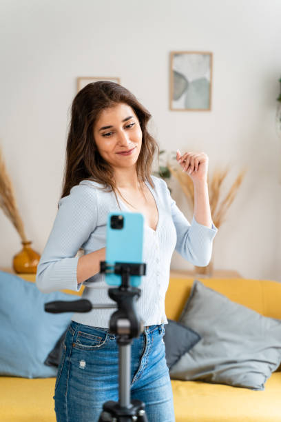 istock Woman recording a dance routine for a social network. 1545858243