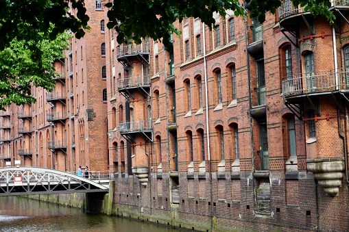 The Speicherstadt, literally: 'City of Warehouses', meaning warehouse district) in Hamburg, Germany, is the largest warehouse district in the world where the buildings stand on timber-pile foundations, oak logs, in this particular case.