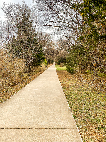 March 29, 2022, Manhattan, Kansas. A walkway provides an opportunity for a leisure walk through the neighborhoods of Manhattan, Kansas.