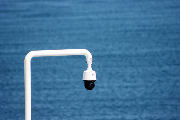 security camera on a white pole stock photo