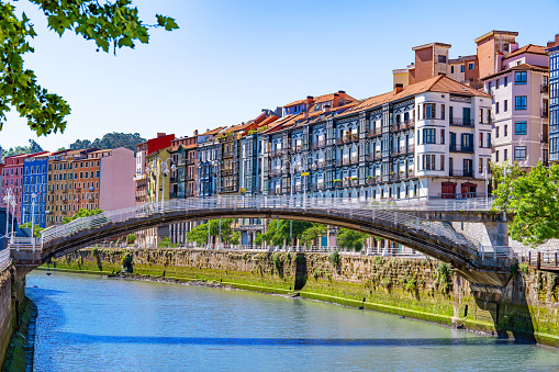 Bilbao Puente de la Ribera bridge over Nervion river and facades in Biscay Basque Country of Spain