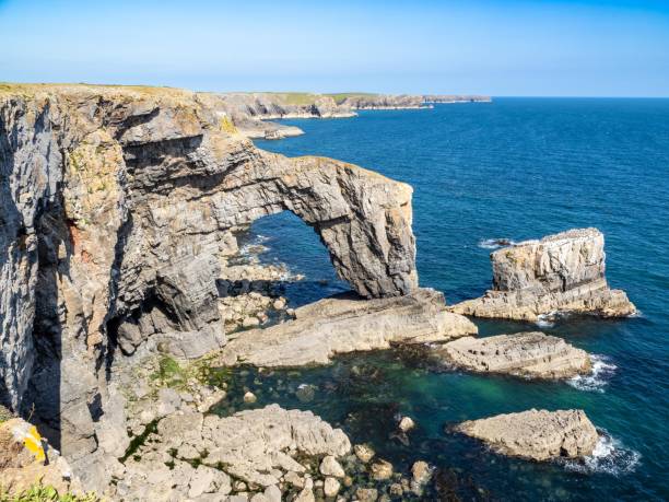 istock Green bridge natural arch, Wales 1546005723