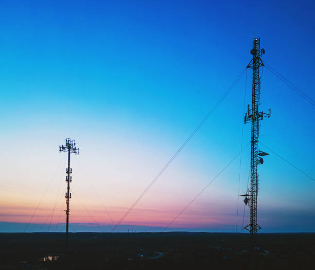 Aerial view of communication towers at dusk.