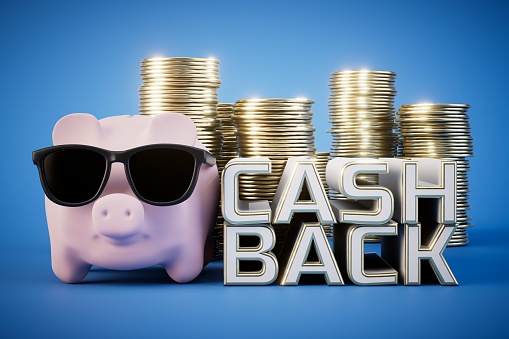 Cash back for big purchases. Piggy bank, dollars coins and the inscription Cash Back on a blue background. 3D render.