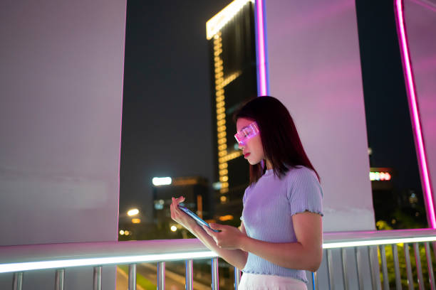 istock Female businessmen at night using virtual reality technology 1546035476
