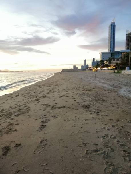 istock Tranquility beach straight to the the tall building. 1546055896