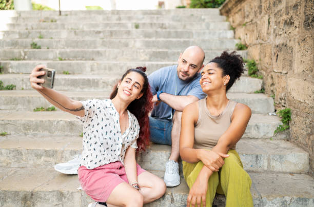 istock Friends taking a selfie outdoors in downtown 1546153070