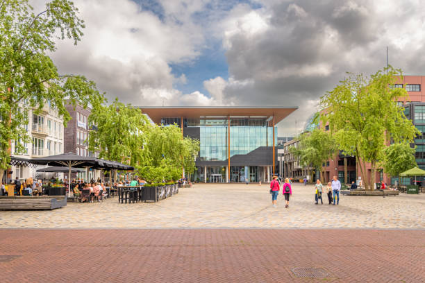 Leeuwarden, The Netherlands -June 12, 2021: Wilhelminaplein in the center of the Frisian capital Leeuwarden with people on the terrace and people walking on the square
