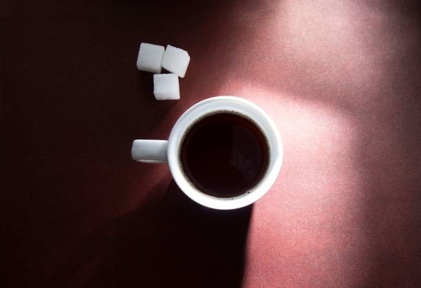 istock a cup filled with coffee and two white sugar cubes 1546254270