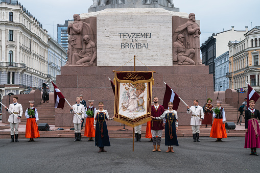 Riga, Latvia - June 2, 2023: Parade participants at the Freedom Monument before the march