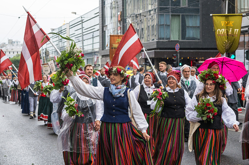 Riga, Latvia - June 2, 2023: Parade participants in the city streets