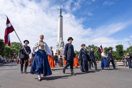Riga, Latvia - June 2, 2023: Parade participants at the Freedom Monument
