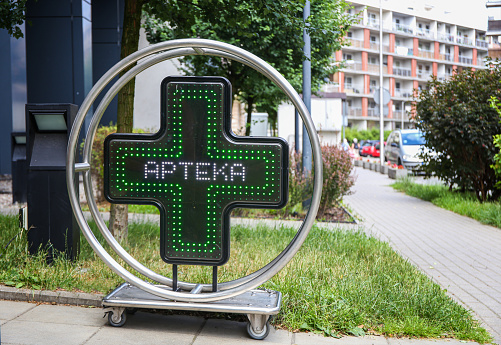 luminous signboard pharmacy near the pharmacy in Poland Apteka