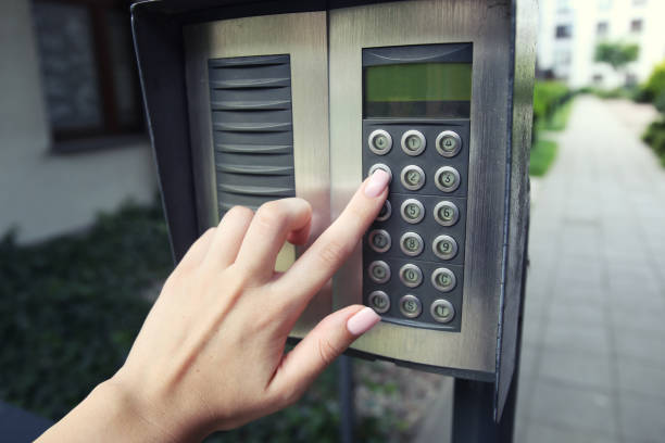istock Woman hand pressing the security code combination to unlock the door 1546298692