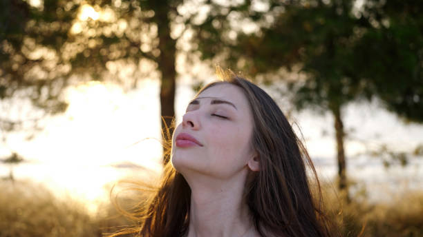 istock Peaceful young woman in nature 1546318702