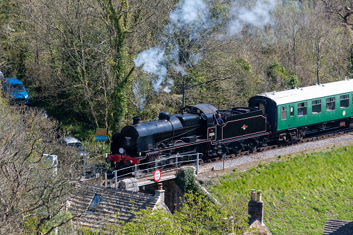 Corfe.Dorset.United Kingdom.April 17th 2023.The 31806 U class steam train is travelling along the Swanage heritage railway line