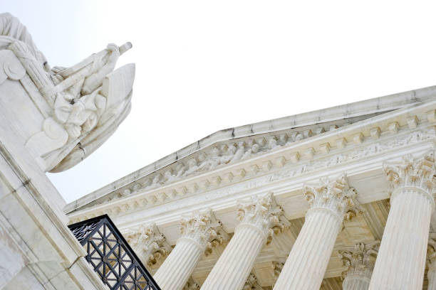 Overcast Supreme Court United States Supreme Court Building in Washington DC on a cloudy overcast day. civil rights act stock pictures, royalty-free photos & images